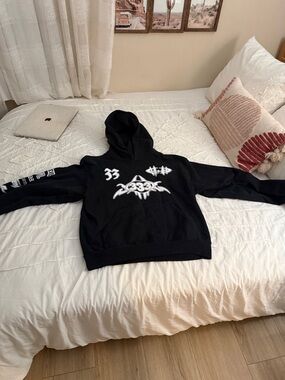 Black Graphic Hoodie with White Emblem Print